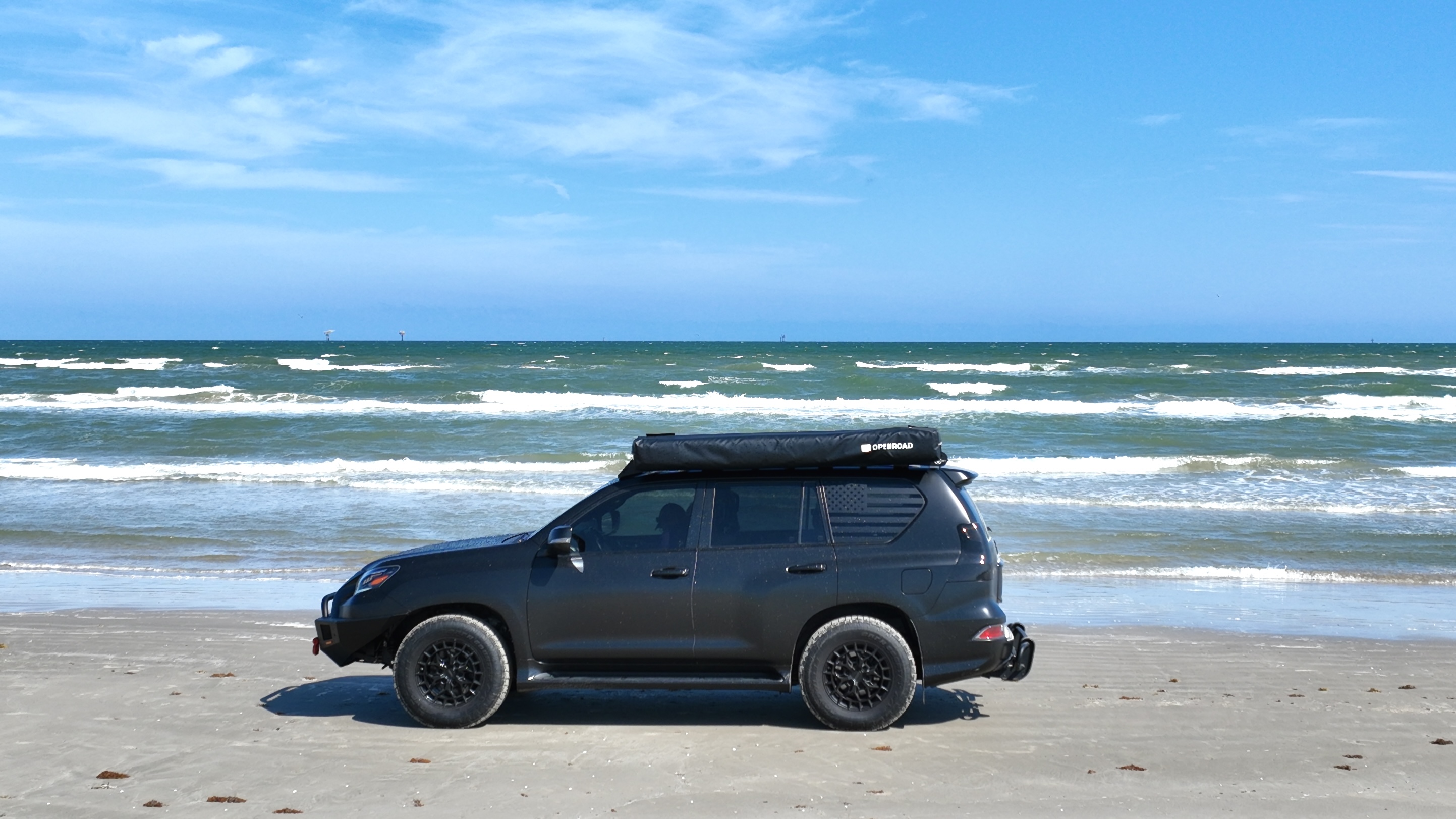 Horacio's Lexus GX 460 on the beach beside the Gulf